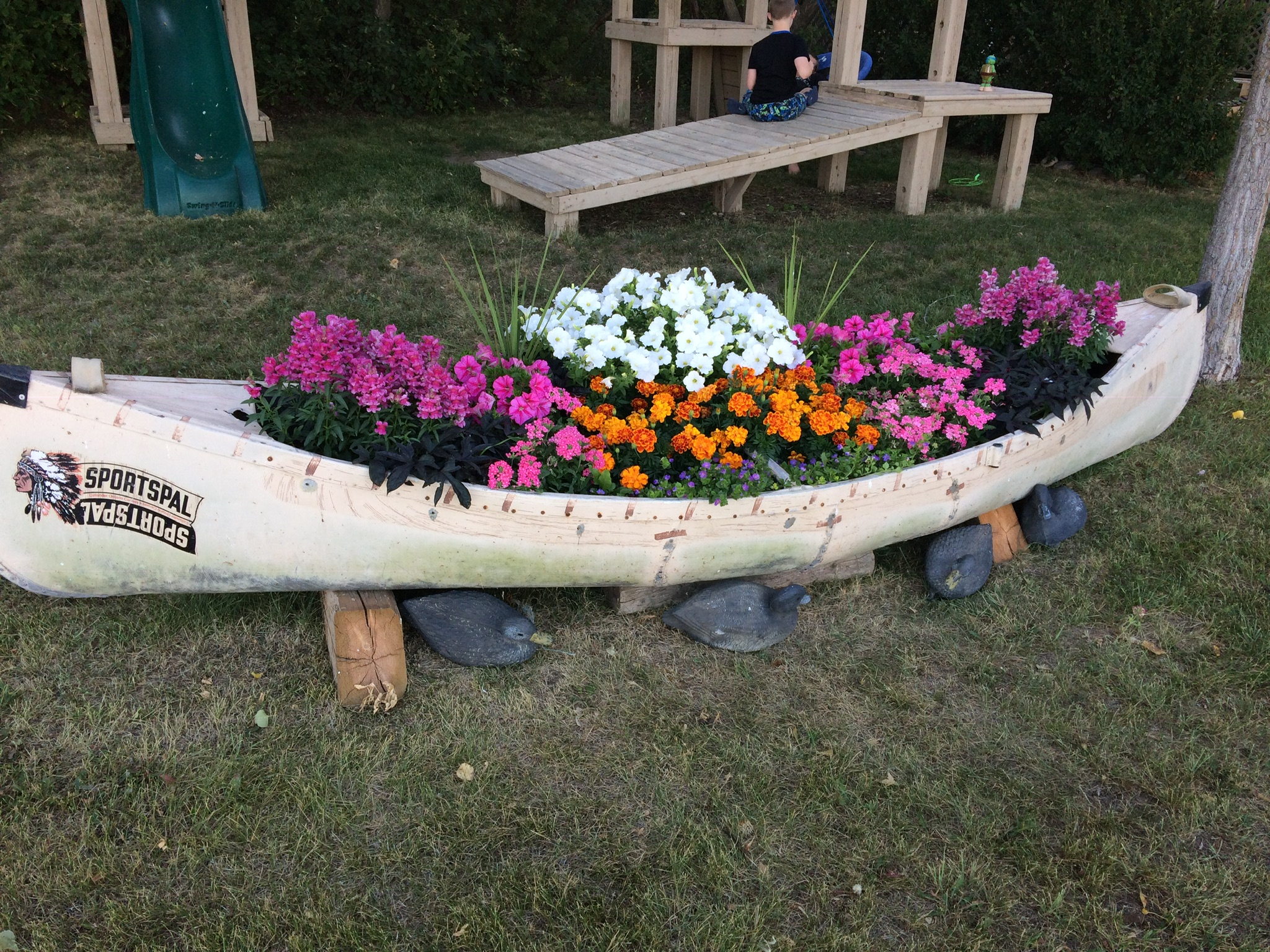 Repurposed Canoe Flower Bed