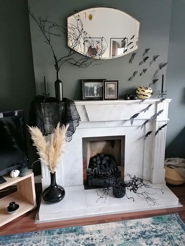 Elegant Minimalist Halloween Fireplace with Bat Decor