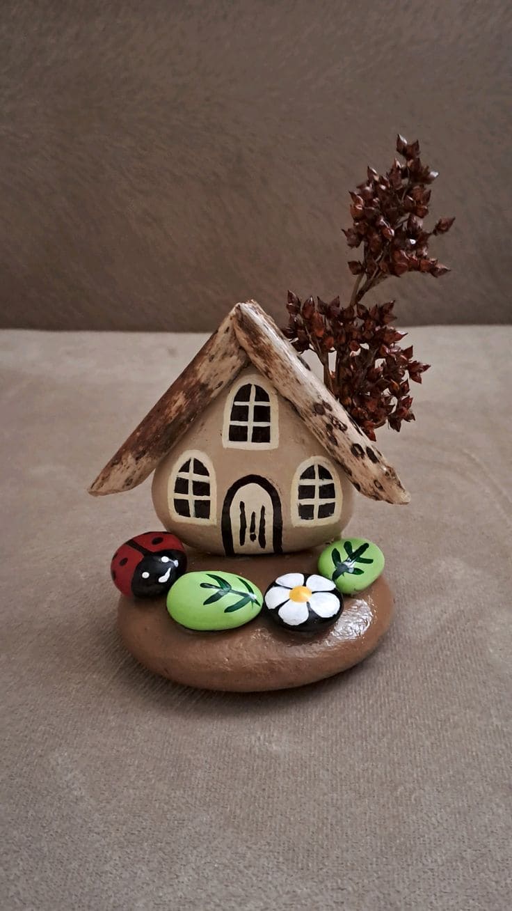 Whimsical Painted Pebble Cottage Scene