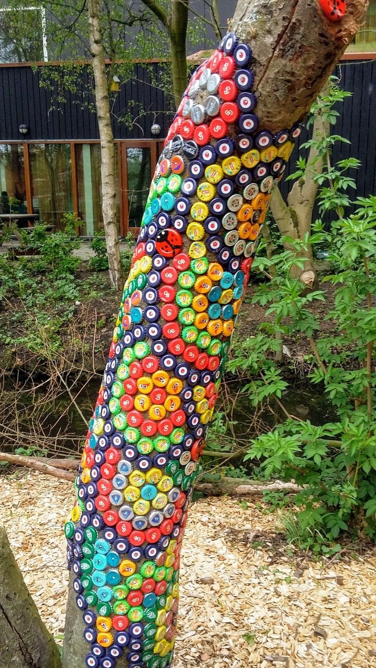 20 Whimsical Tree Trunk Projects That Transform Your Outdoor Space Bottle Cap Mosaic Tree Art