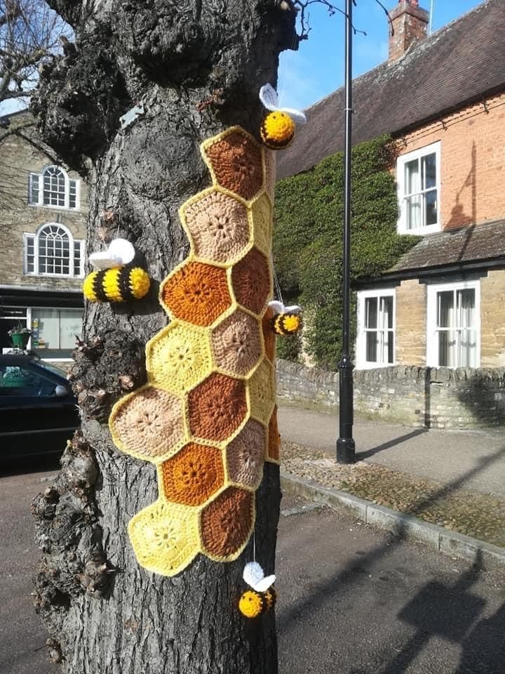 20 Whimsical Tree Trunk Projects That Transform Your Outdoor Space Crochet Beehive Tree Wrap