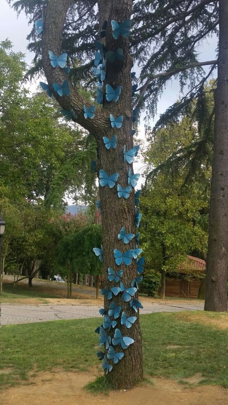 20 Whimsical Tree Trunk Projects That Transform Your Outdoor Space DIY Butterfly Tree