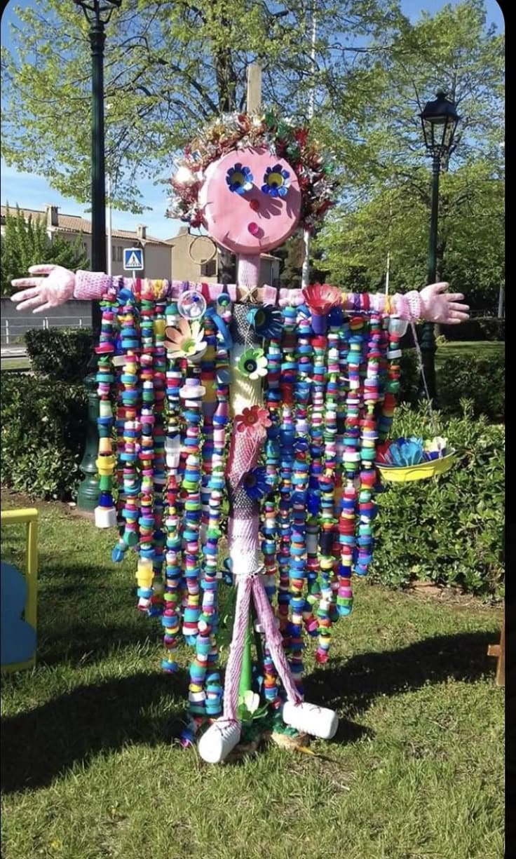 Recycled Rainbow Bottle Cap Scarecrow