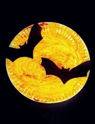 Bat Silhouettes Over a Harvest Moon