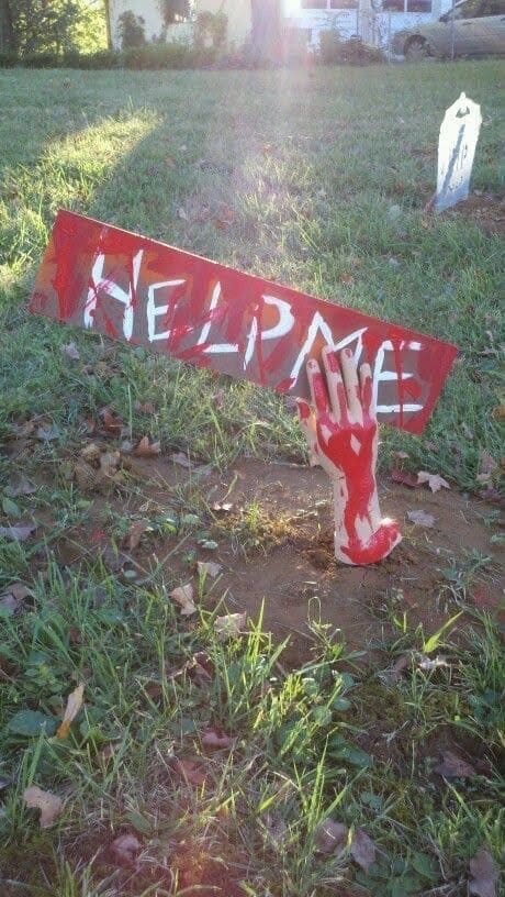 Bloody Hand with “HELP ME” Sign
