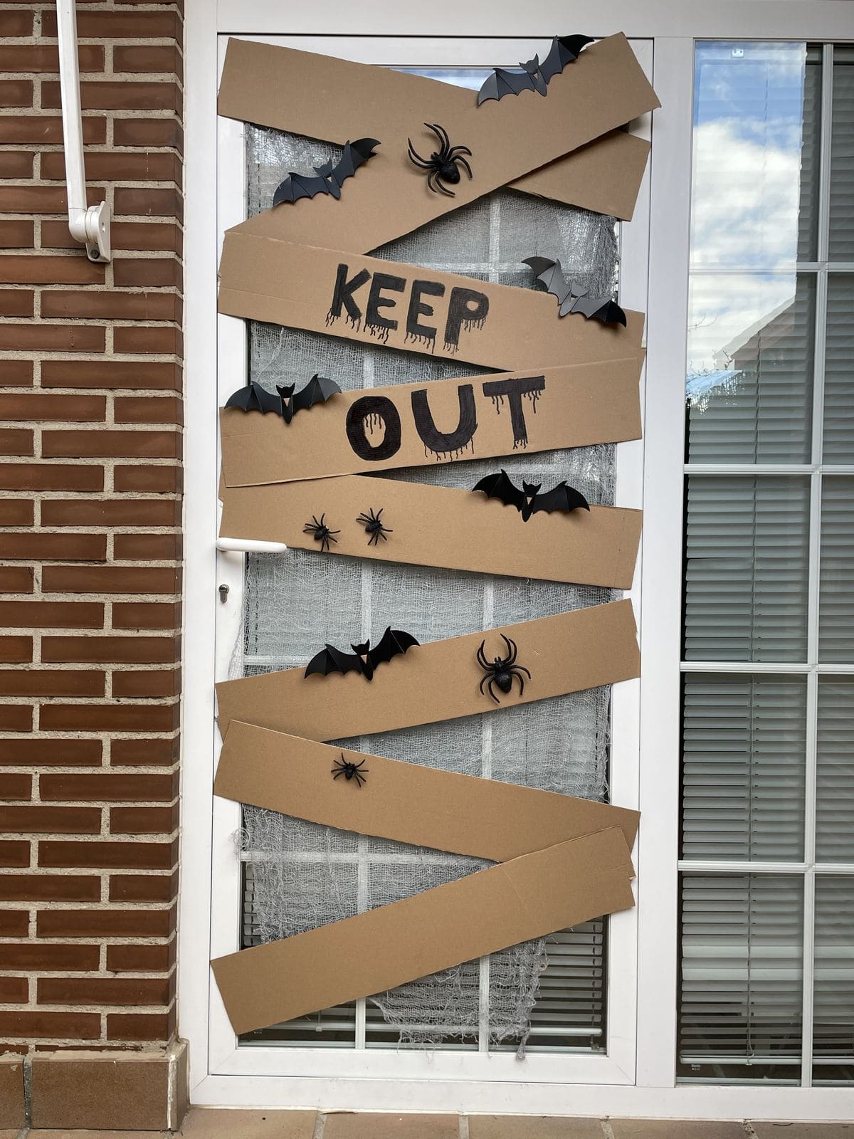25 Unique Halloween Door Ideas That Will Stop Guests in Their Tracks