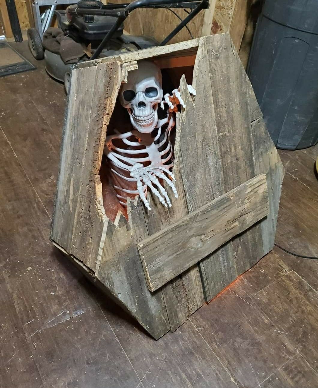 Half-Broken Coffin with Escaping Skeleton