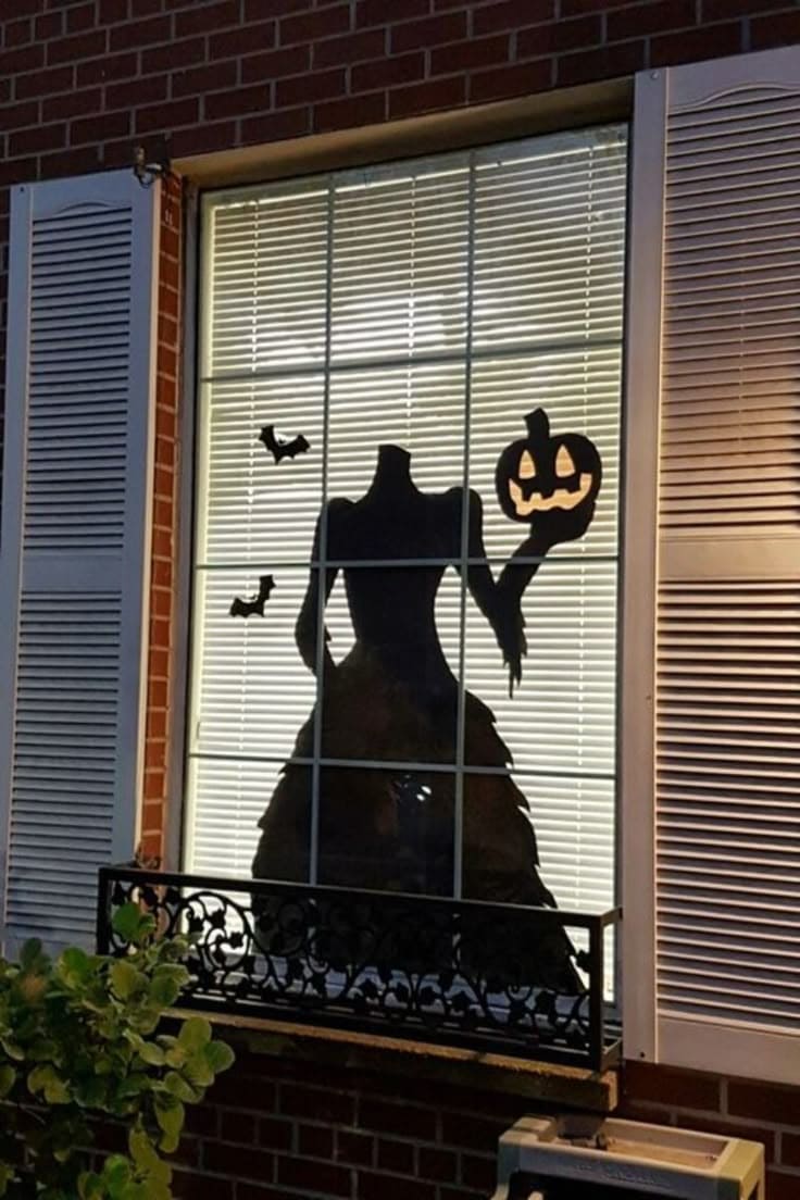 Headless Lady with Pumpkin Silhouette Halloween Window