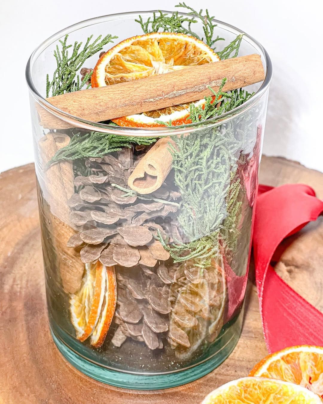 Citrus and Pinecone Jar Centerpiece