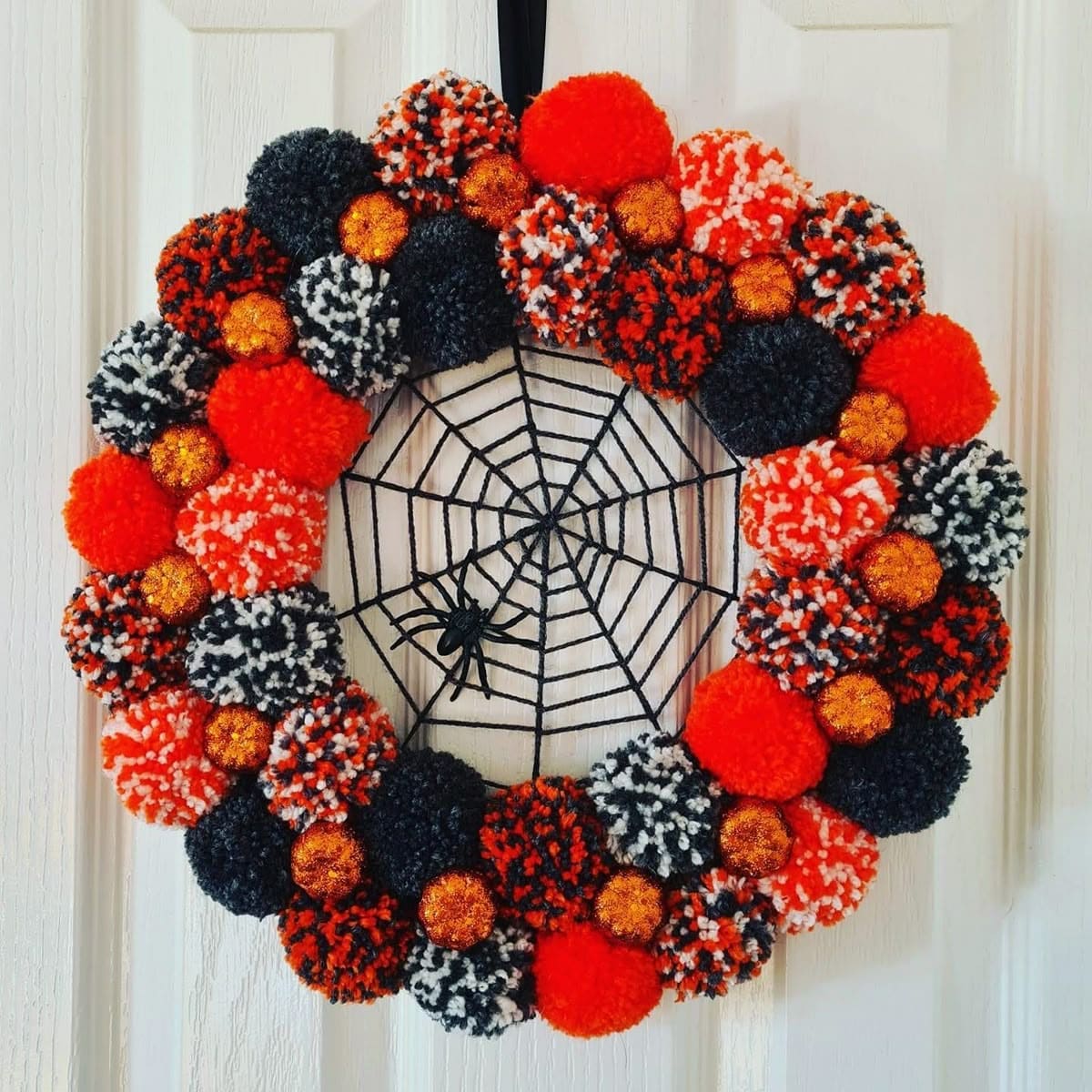 How to Make a Spooky-Cute Halloween Pom-Pom Wreath