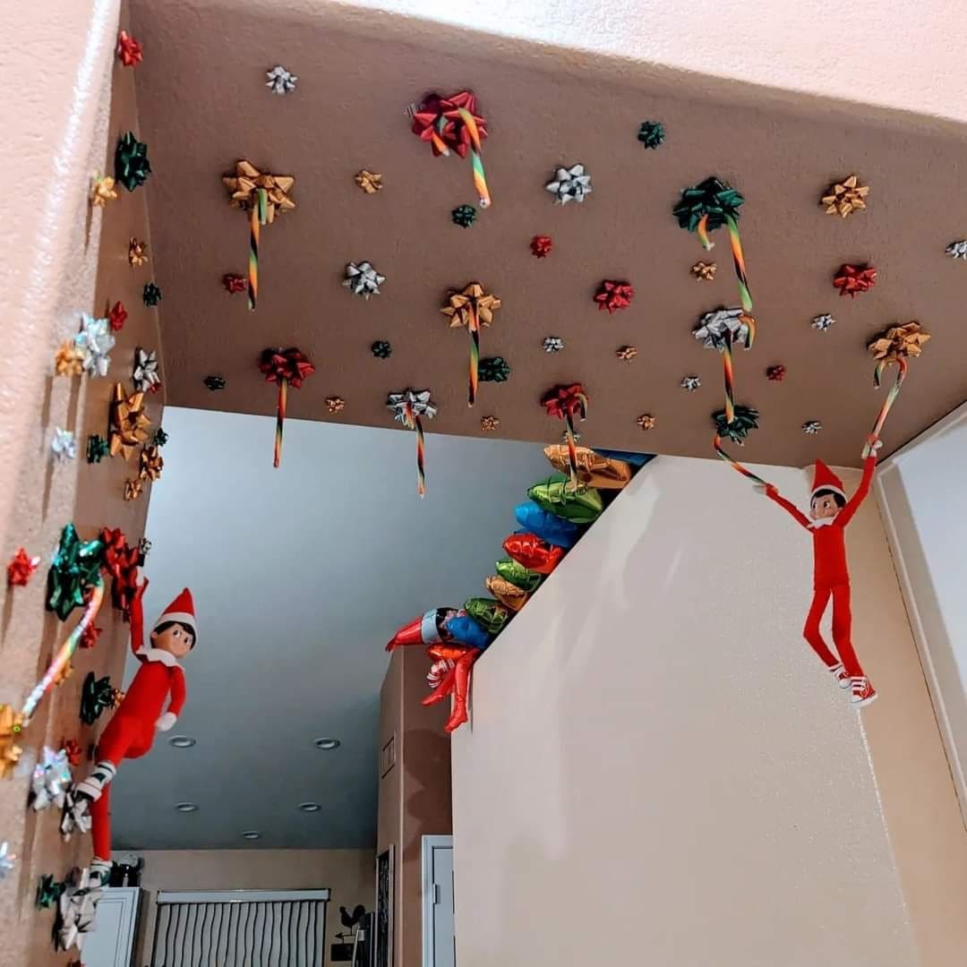 25 Hilarious Elf on the Shelf Ideas Crack Up the Whole Family Elves in a Gift Bow Jungle