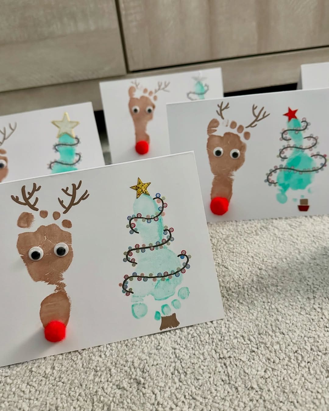 20 Fun Christmas Footprint Crafts to Make with Little Feet Footprint Reindeer and Tree Cards