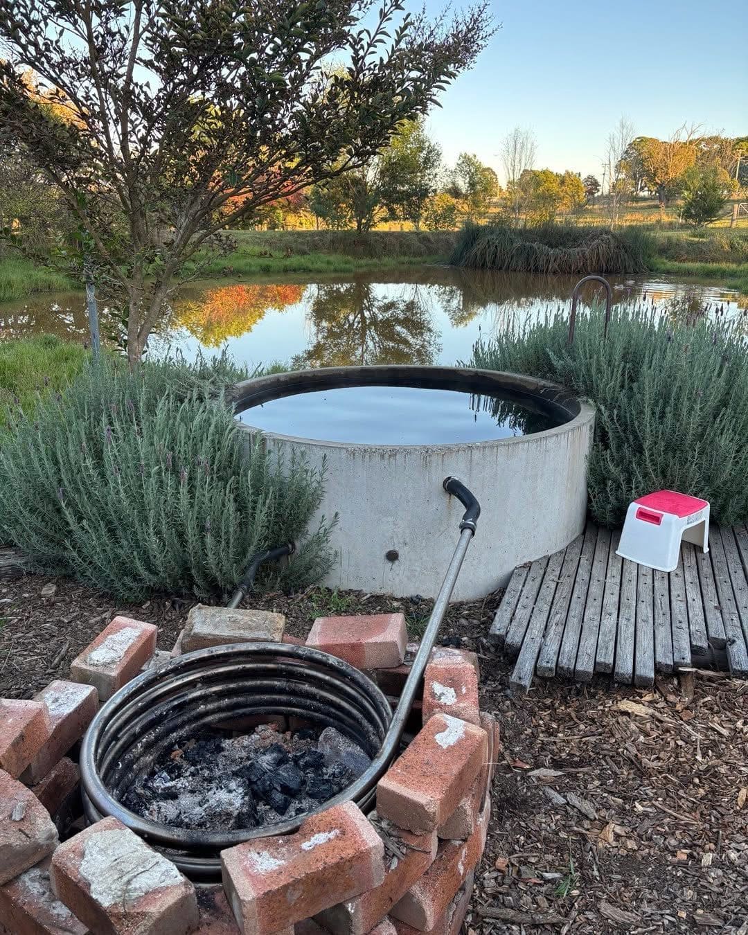 20 Outdoor Hot Tub Setups That Redefine Home Relaxation Lakeside Coil-Heated Soaking Tub