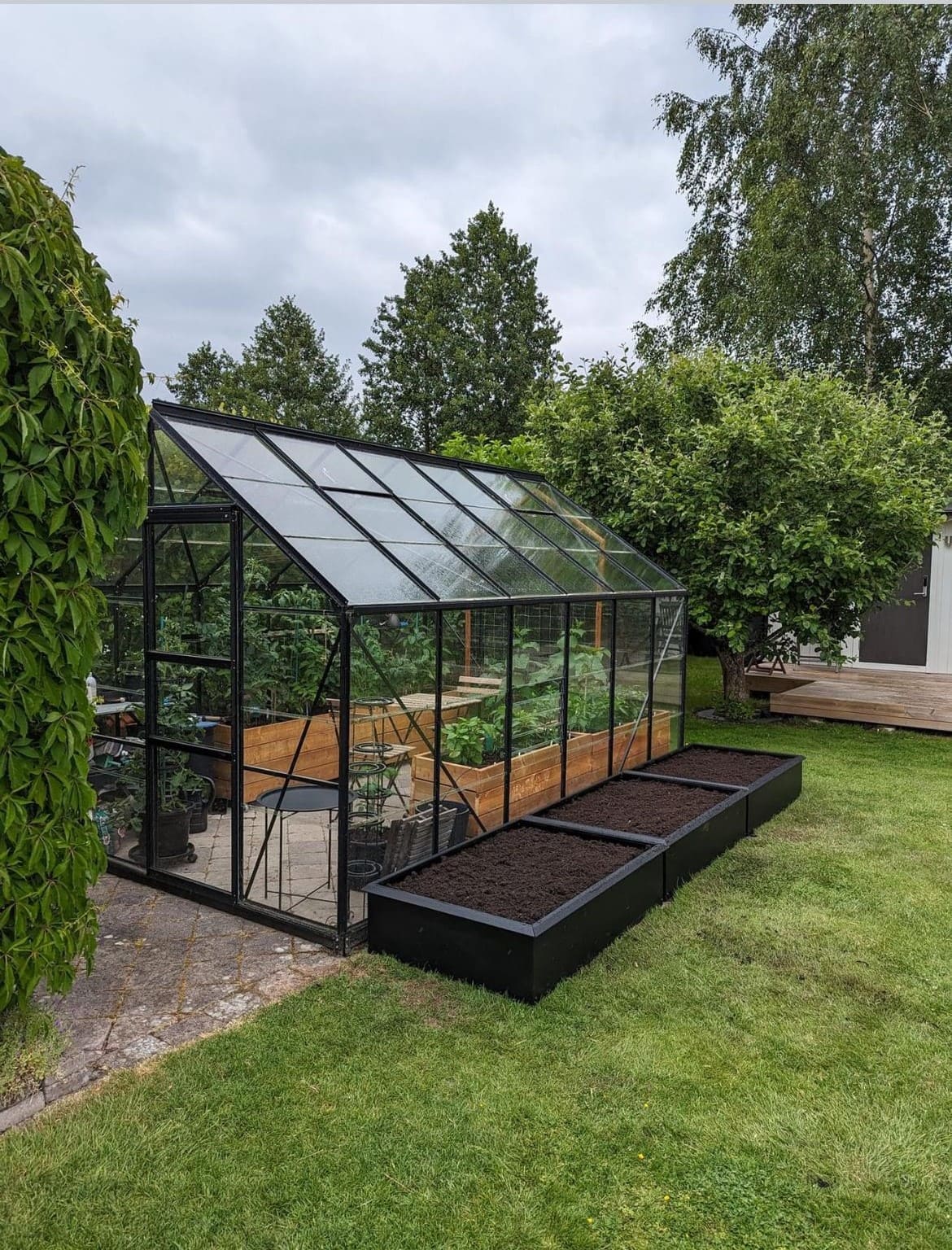18 Homestead Garden Layout Ideas for Self-Sufficient Living Modern Glasshouse Gardening Retreat