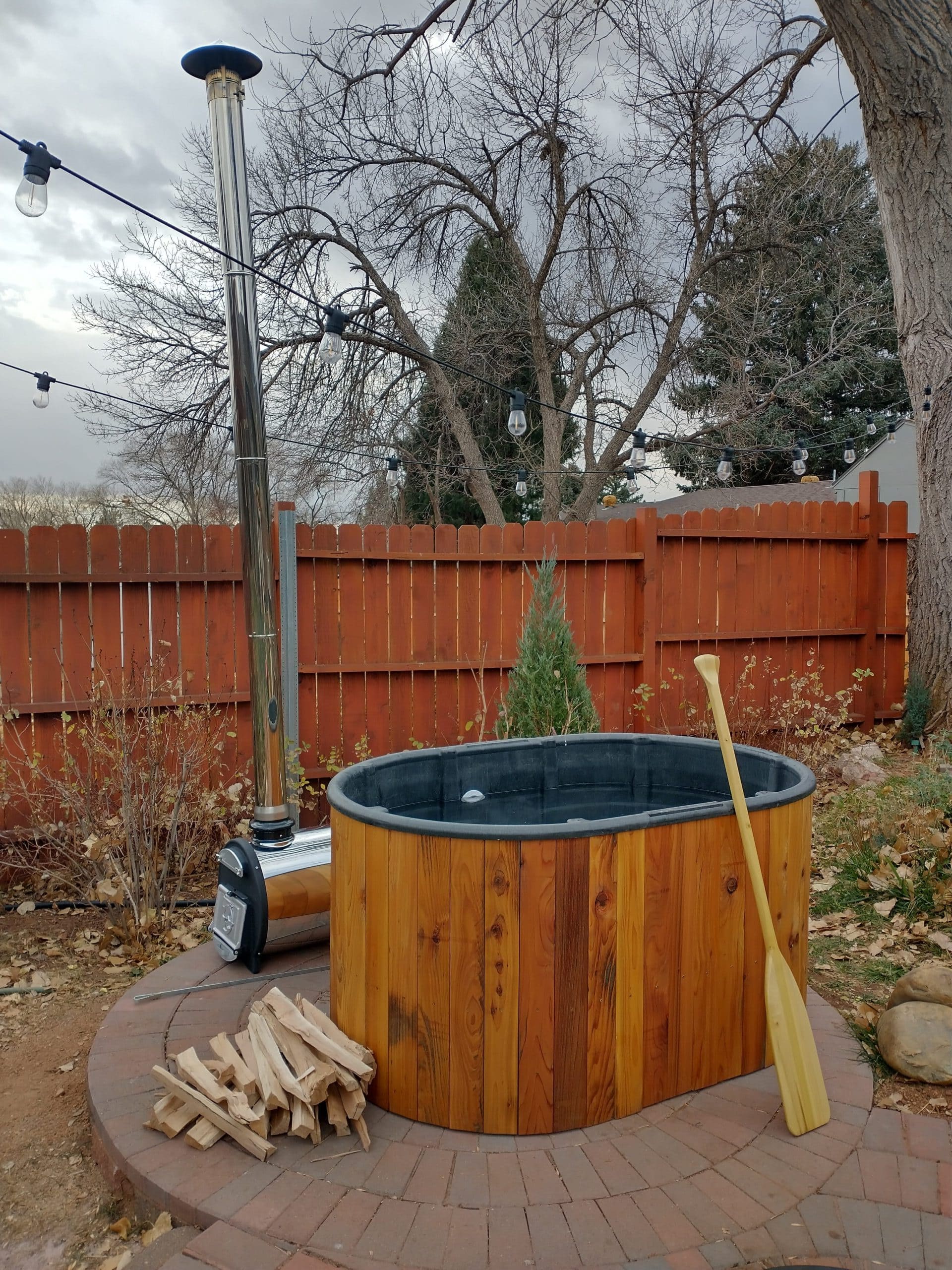 20 Outdoor Hot Tub Setups That Redefine Home Relaxation Rustic Backyard Barrel Spa