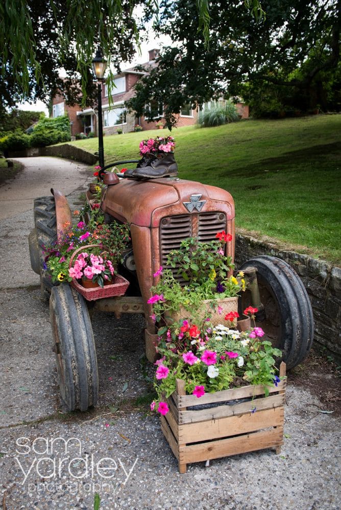 10 Creative Ways to Upcycle Old Tractors for Your Home Rustic Tractor Flower Planter