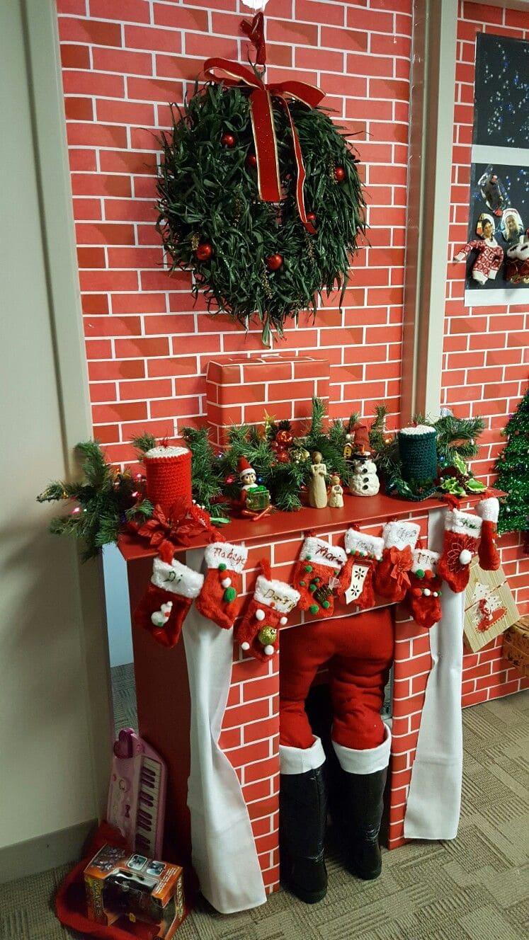 Santa Stuck in the Faux Fireplace