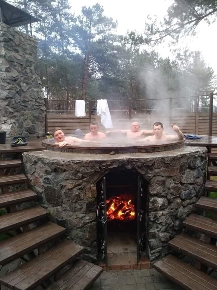 20 Outdoor Hot Tub Setups That Redefine Home Relaxation Stone Hearth Soaking Retreat