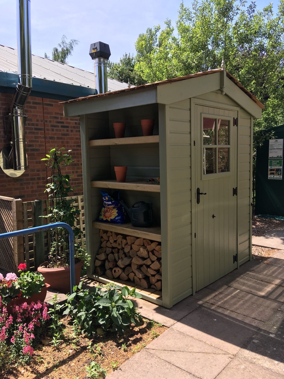 25 Stunning Garden Shed Ideas to Elevate Your Backyard Space Functional Green Shed with Wood Storage
