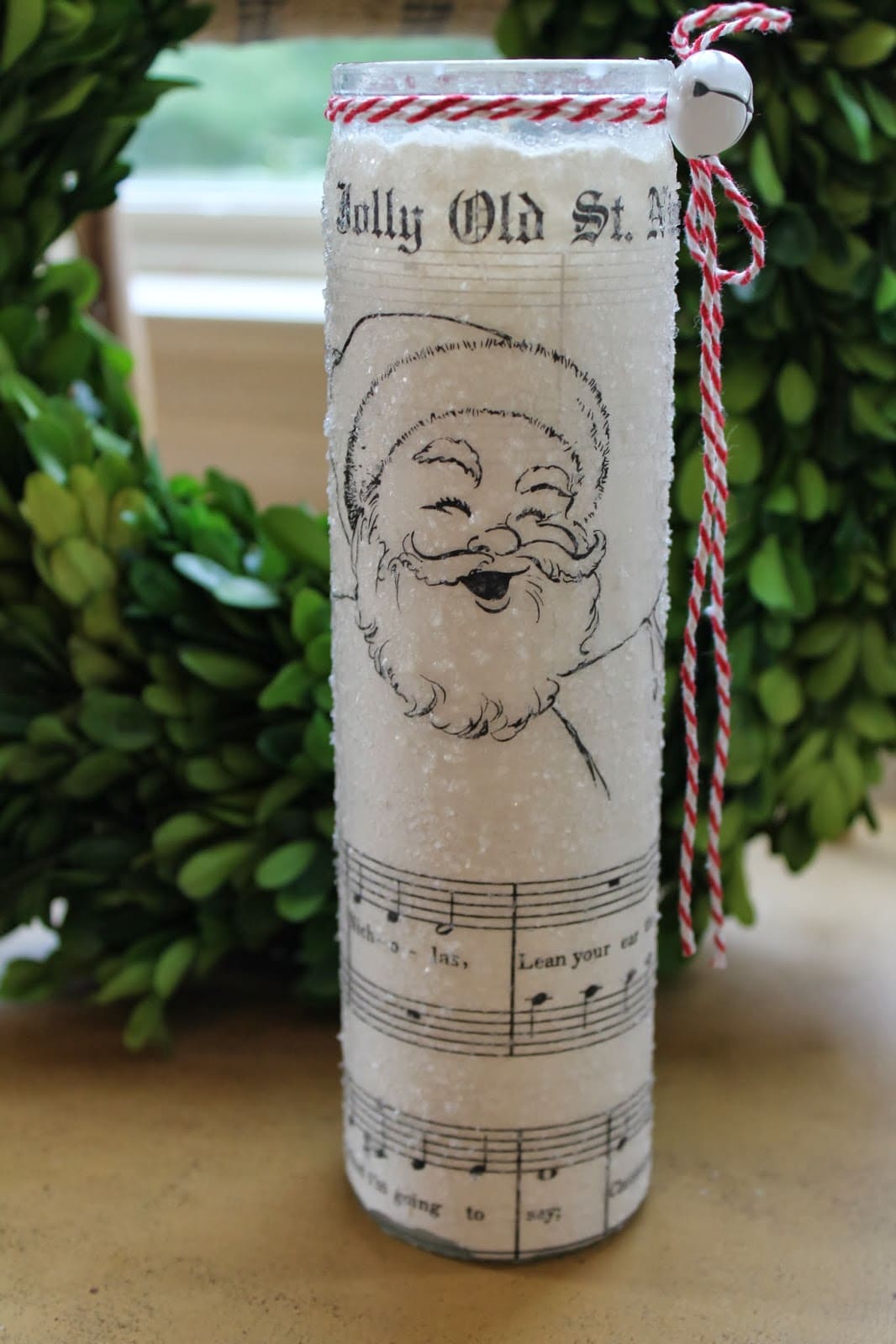 20 Beautiful Music Sheet Crafts to Add Harmony to Your Home Jolly Santa Music Sheet Candle