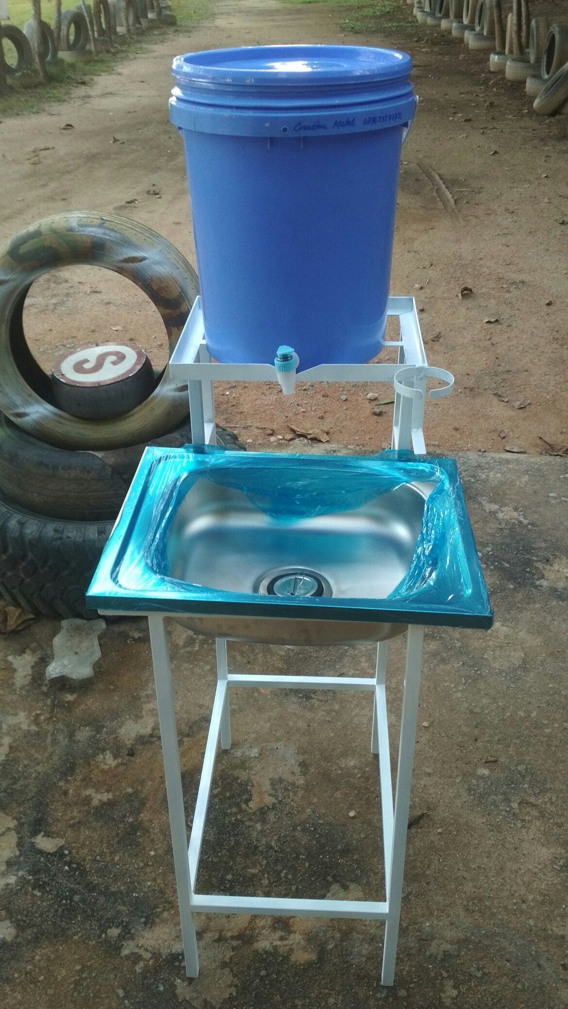 22 Brilliant Hand-Washing Station Ideas for Indoors & Outdoors Simple Bucket-Top Wash Stand