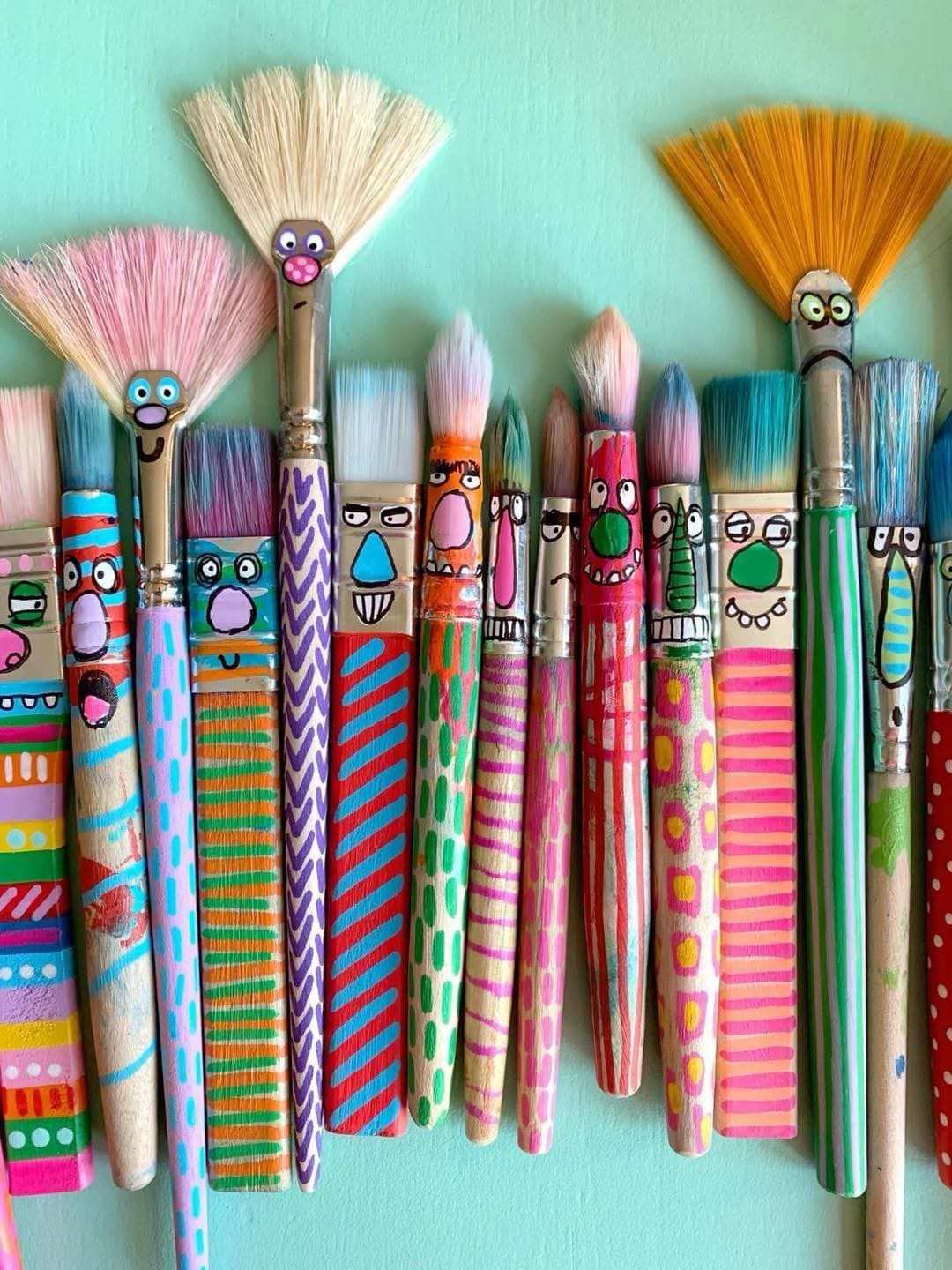 20 Brilliant Ways to Give Paint Brushes a Second Life Whimsical Paintbrush Family Wall Art